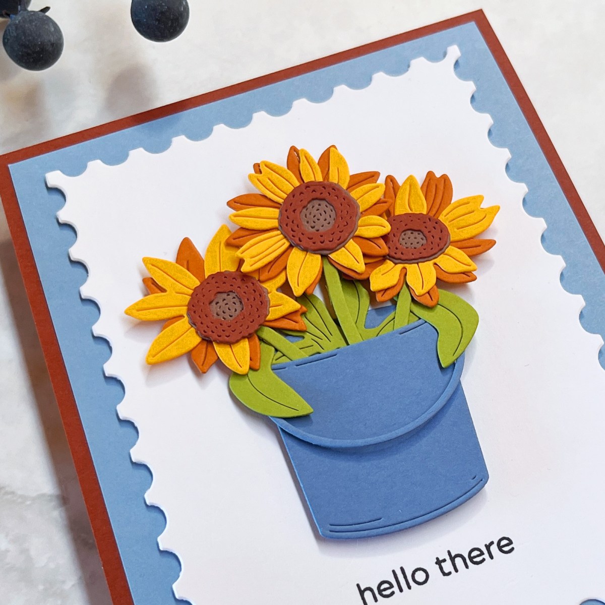 Closeup of die-cut sunflower card showing dimension from foam squares. 